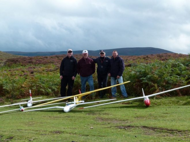 Radio controlled gliders on the ground with their owners